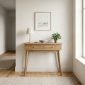 Oak-finish hallway console table with 2 drawers, lamp and plant