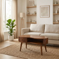 Wave edge chestnut coffee table in front of a linen sofa