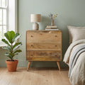 Curved Mango Wood Chest of Drawers, Oak Finish, 70 cm in a room